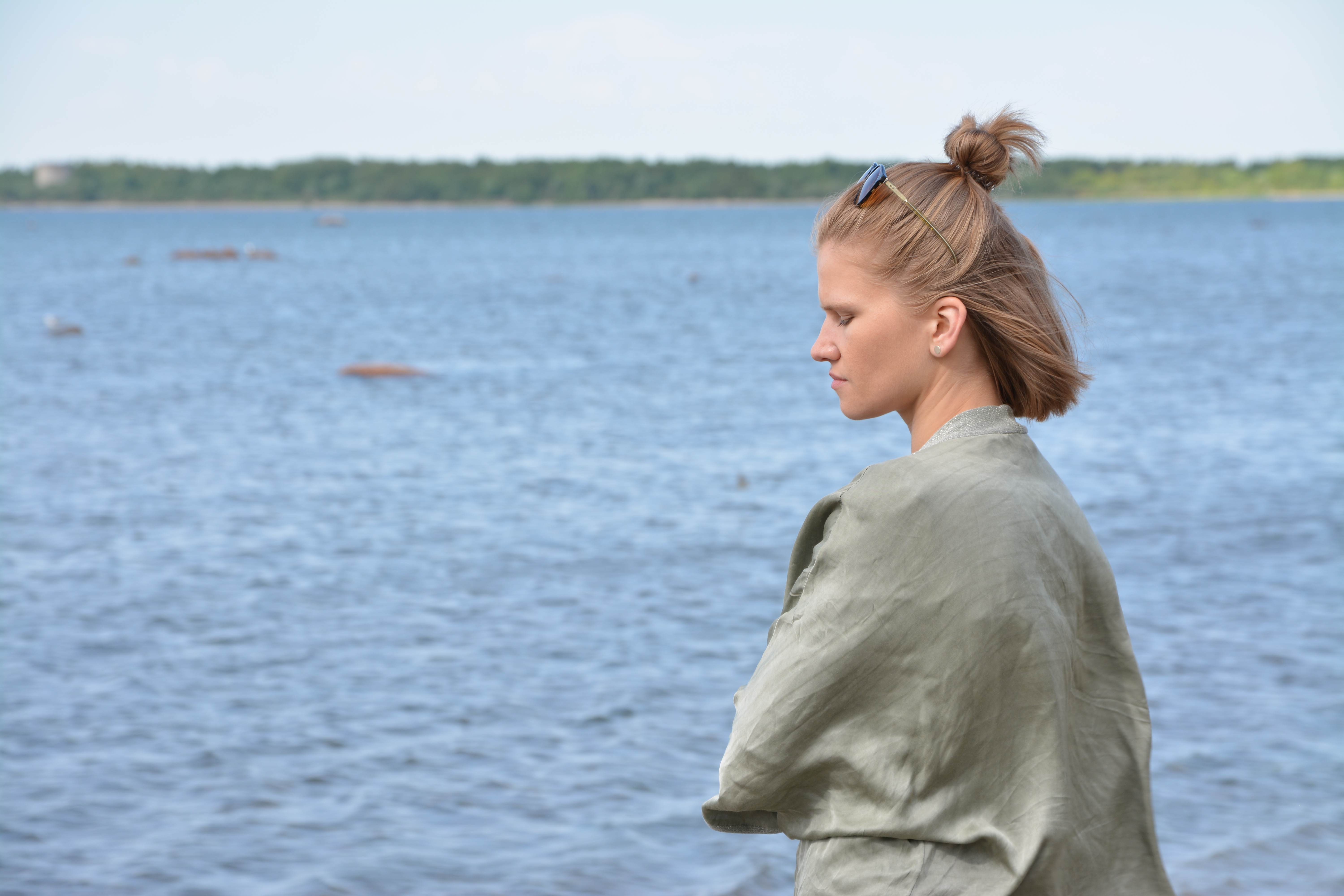The Estonian singer and violinist Maarja Nuut in front of the Baltic Sea.